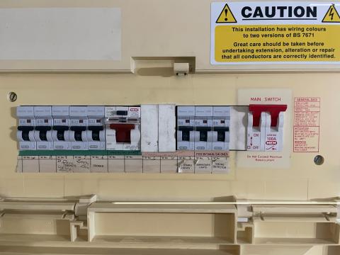 A picture of an old fuseboard which is not fully protected by RCD's. This fuseboard should be upgraded by a registered electrician.