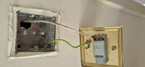 A lighting circuit with no earth and a metal switch.