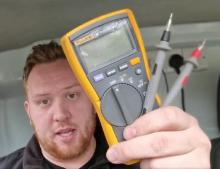 Electrician in Bath and West Wiltshire showing a multimeter used for testing when installing new lights