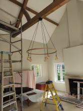 A new decorative wooden chandelier with warm white LED bulbs.