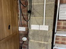 Installation of 2x new double sockets in a garage in Corsham with the cables contained in PVC conduit 