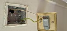 A lighting circuit with no earth and a metal switch.
