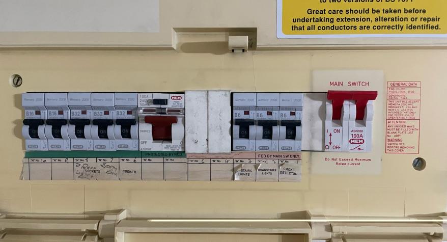 A picture of an old fuseboard which is not fully protected by RCD's. This fuseboard should be upgraded by a registered electrician. 
