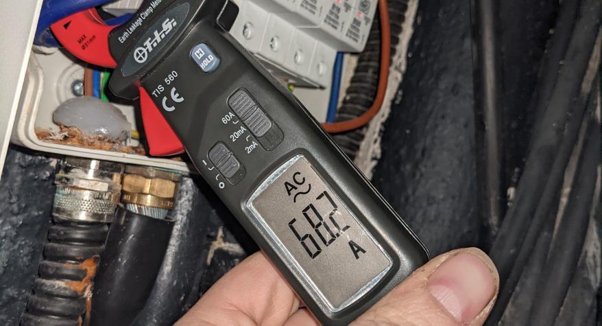 Registered electrician in Bath carrying out fault finding during an electrical installation condition report/EICR